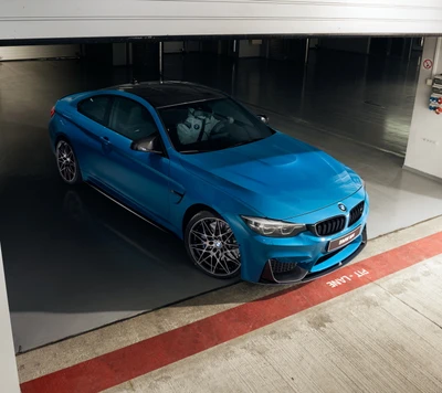 BMW M4 in a sleek underground garage setting.