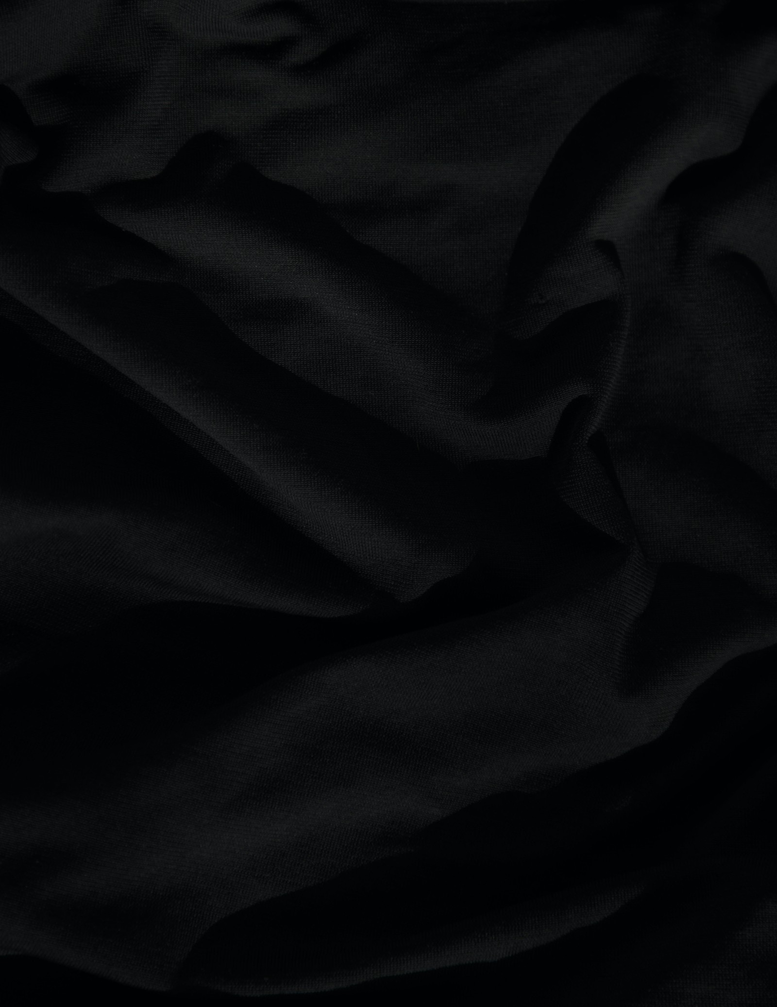 A close up of a black cloth with a white background (atmosphere, sleeve, gesture, grey, cloud)