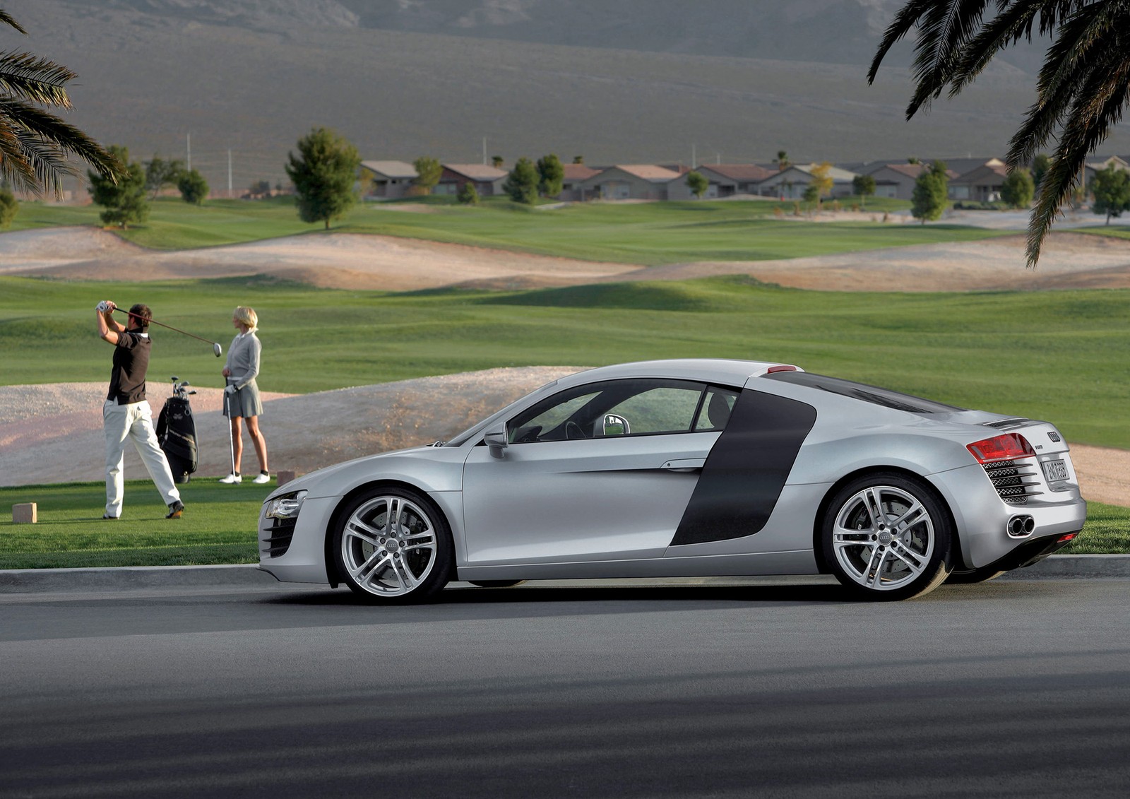 Arafed sports car parked on a road with people walking by (car, audi, audi r8, sports car, apples)