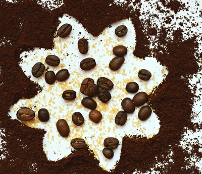 Coffee Bean Artistry: A Fusion of Ground Coffee and Beans on a White Canvas