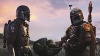 Boba Fett and The Mandalorian with Baby Yoda in a Distant Landscape