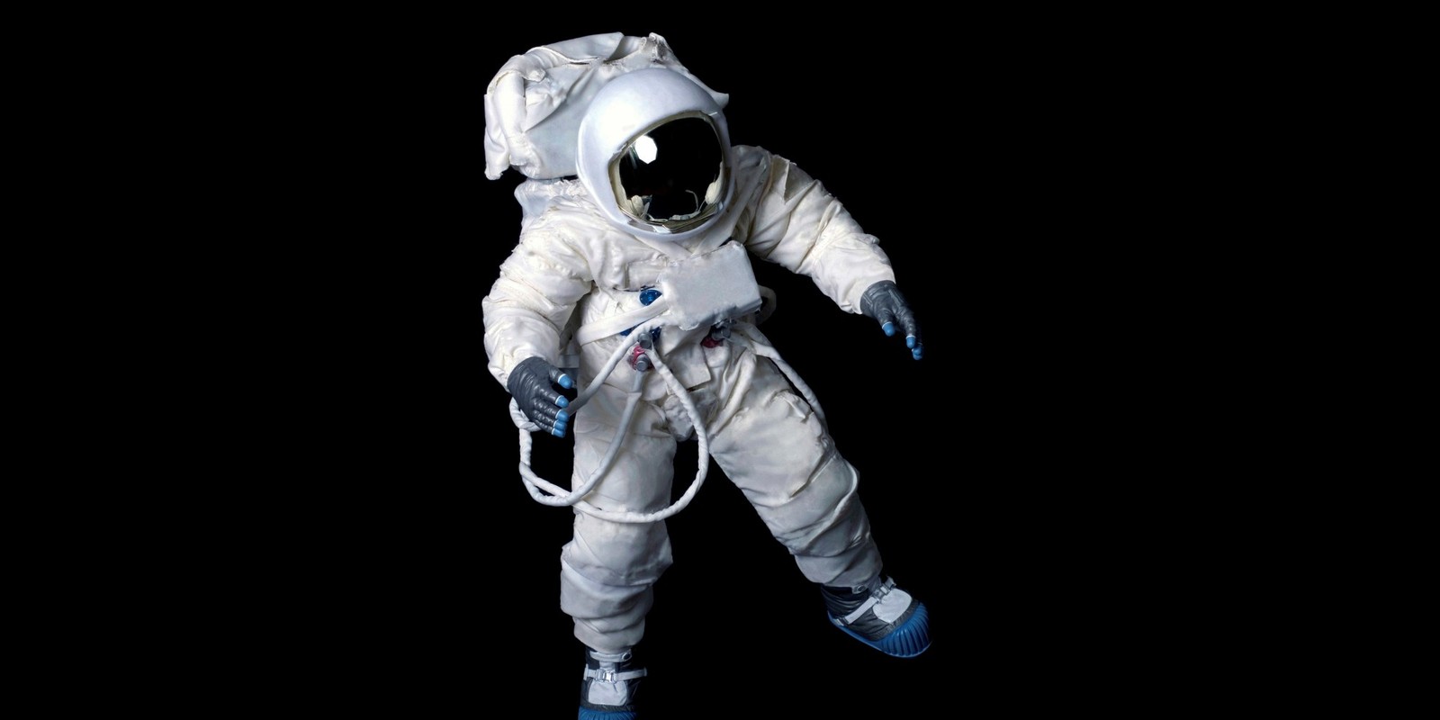 An astronaut in a white space suit is standing in the dark (astronaut, space, costume, research, space science)