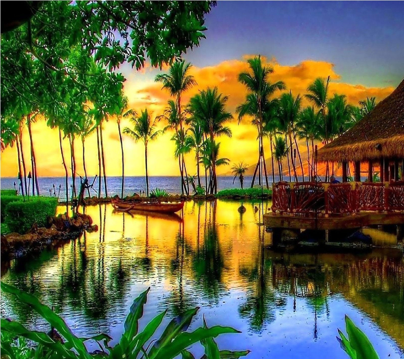 Sunset over a tropical resort with a dock and a boat (sunset, tropical, view)