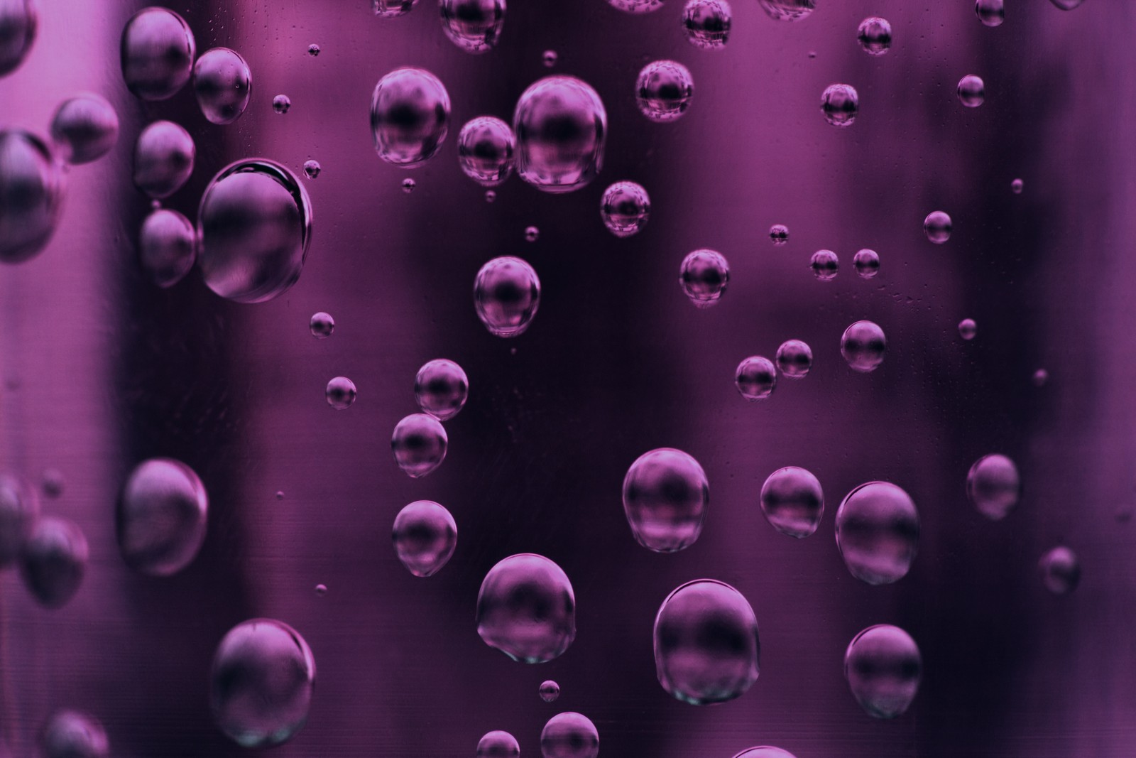 A close up of a purple liquid filled glass with bubbles (color, newyear, newyou, zabstract, znewyear19)