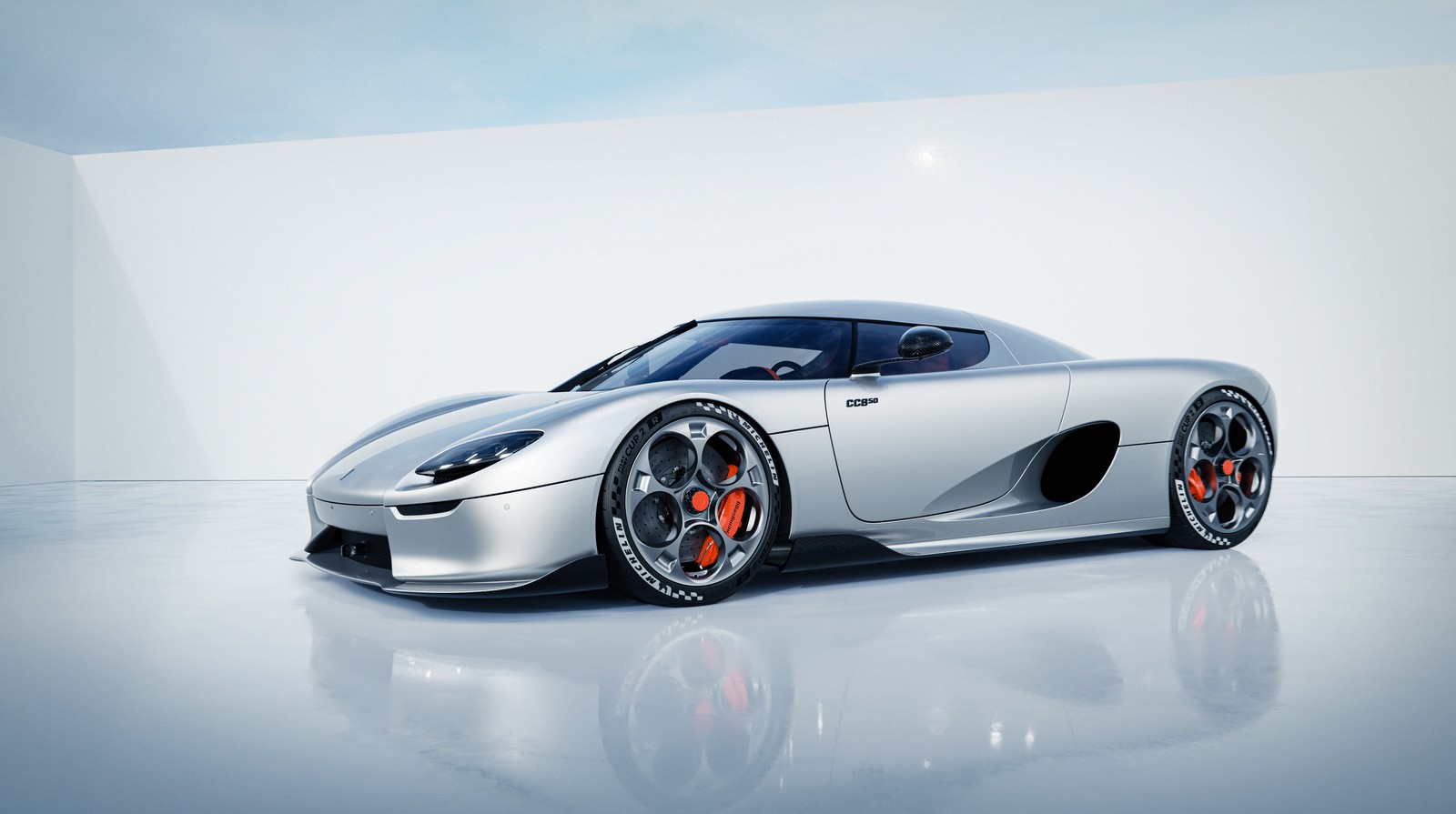 A close up of a silver sports car in a white room (koenigsegg cc850, hypercars, 2022, white background, 5k)