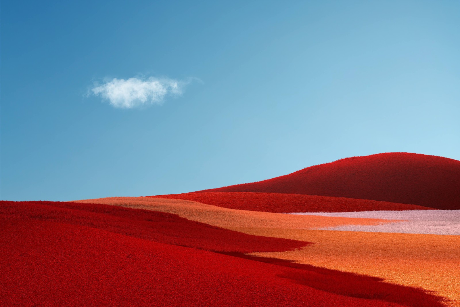 Un nuage solitaire est vu au-dessus d'une colline rouge au loin (microsoft surface, microsoft surface pro, microsoft, environnement naturel, paysage)