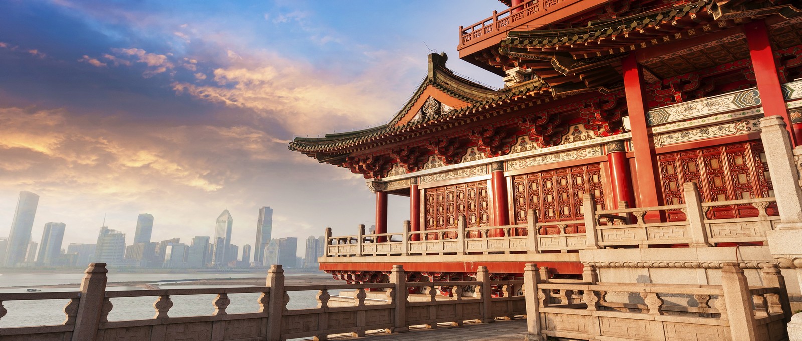 A view of a building with a view of a city in the background (chinese architecture, japanese architecture, landmark, temple, building)