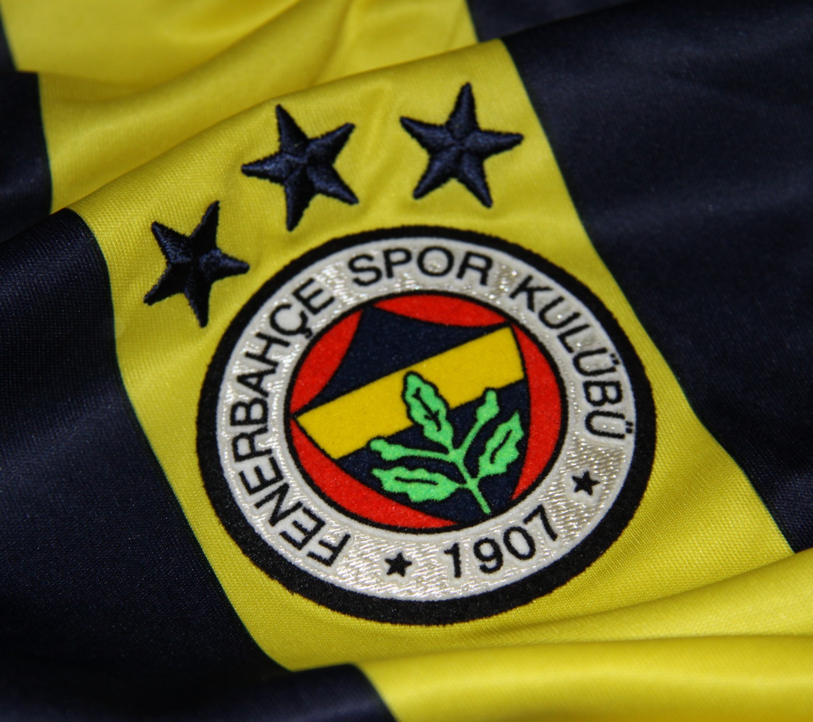 A close up of a soccer jersey with a yellow and black stripe (fenerbahce, football, logo, sport, tff)