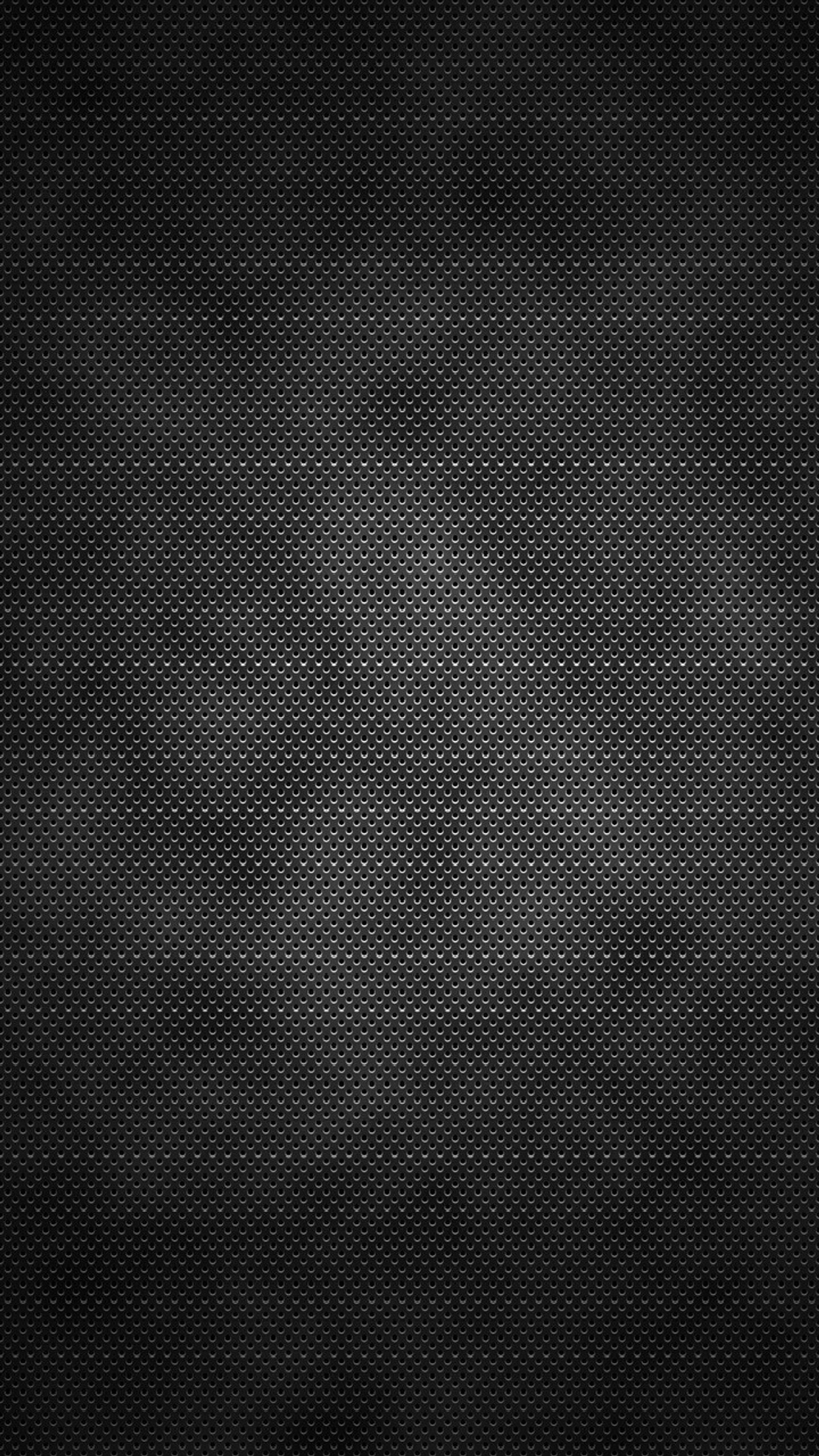 A black background with a grid pattern and a dark background (metal, perforated)