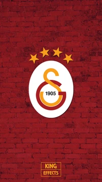 Galatasaray Logo with Four Stars on a Red Brick Background