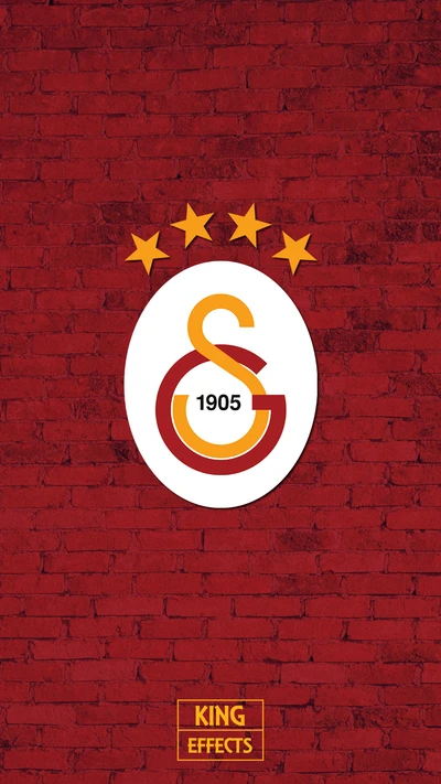 Galatasaray Logo with Four Stars on a Red Brick Background