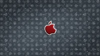 Red apple logo surrounded by a patterned backdrop of snowflakes.