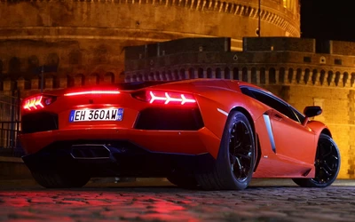 Lamborghini Aventador SV 2017 en un rojo llamativo contra un fondo histórico.