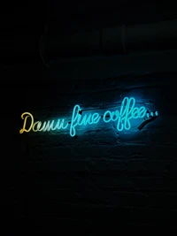 Neon Sign Reading 'Damn Fine Coffee' in Electric Blue and Green