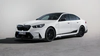 BMW M5 with M Performance Parts in sleek white finish