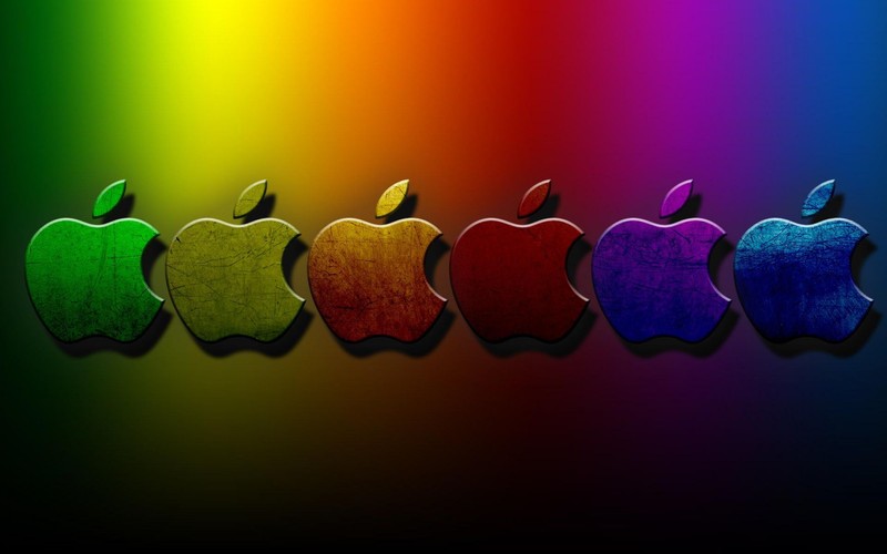 Eine gruppe von apple-logos in einer reihe mit einem regenbogen-hintergrund (apfel, rot, grün, text, herz)