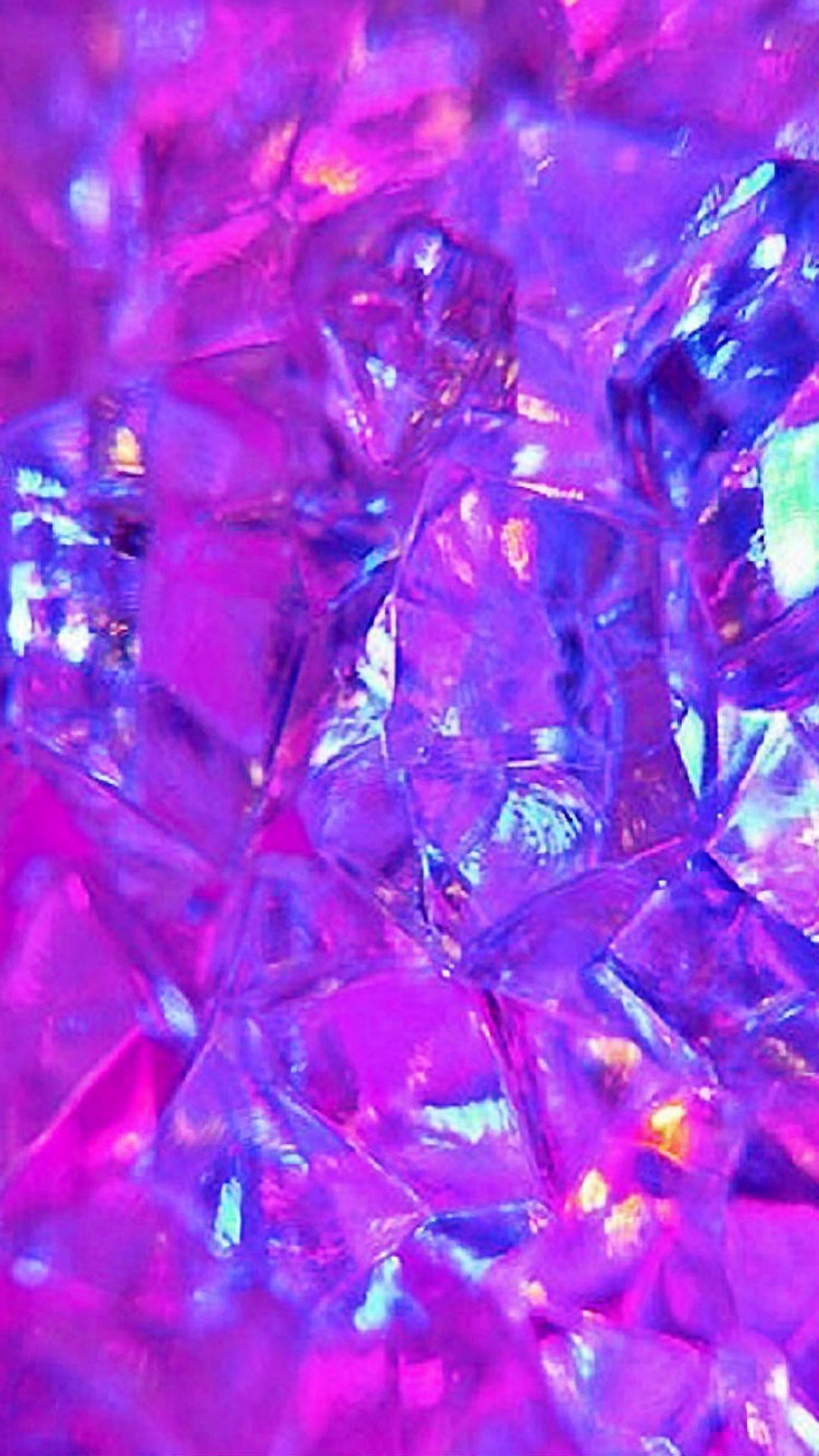 Purple and blue crystals are scattered together on a pink surface (beauty, color, crystals, pretty, purple)