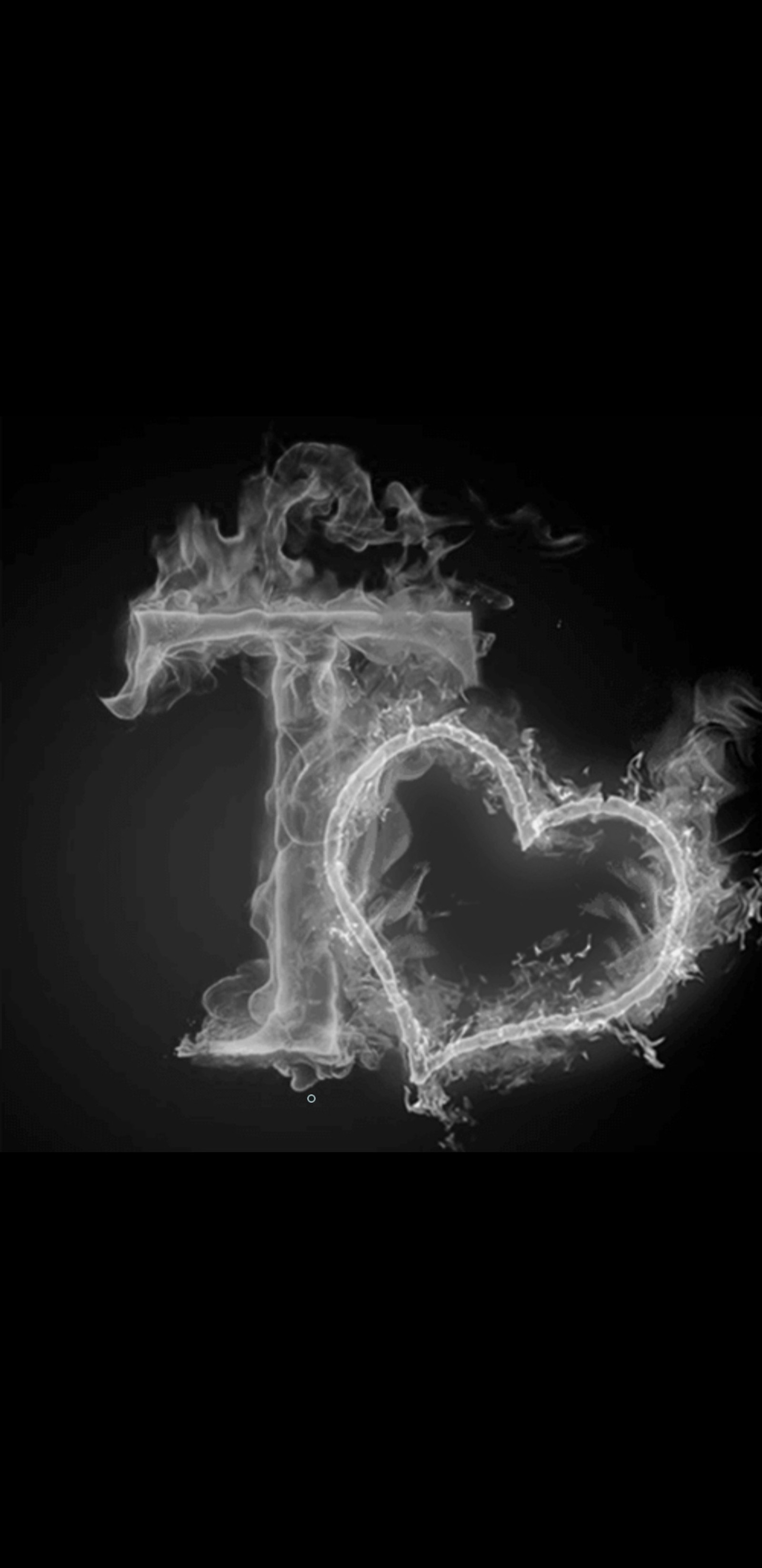 A black and white photo of a heart made of smoke (smoke, black, letter, alphabets, letters)