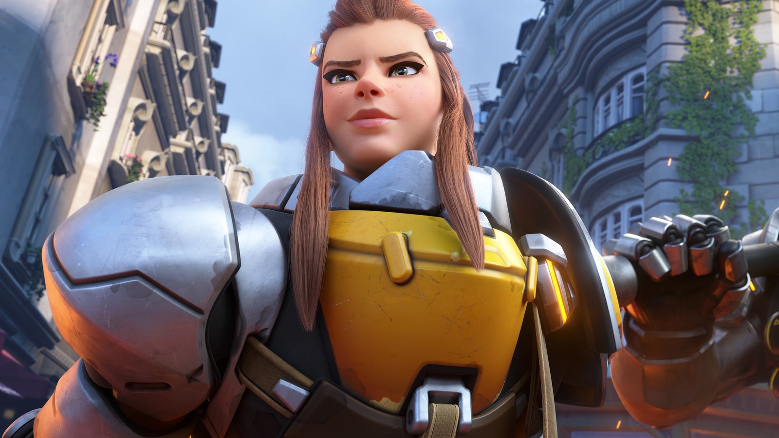 Un primer plano de una mujer en un traje amarillo y negro (brigitte, overwatch 2, videojuego, overwatch)