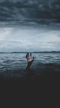 Hopeful Hand Reaching Through Dark Waters