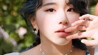 Chaeyoung from TWICE with a soft gaze and elegant accessories, capturing the essence of K-pop.