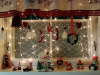 Festive Christmas Window Display with Twinkling Lights and Ornaments