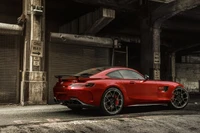 Red Mercedes-Benz AMG GT in an urban setting.