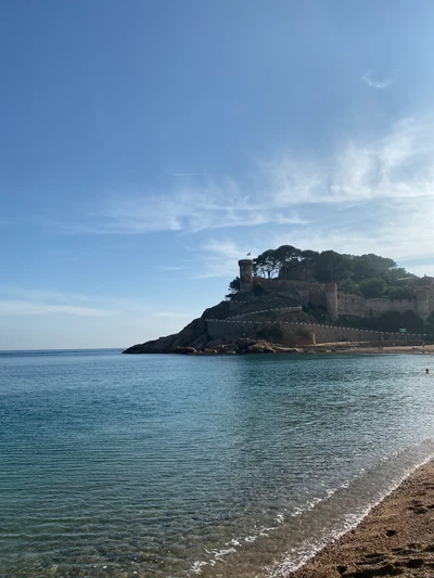 Scenic Coastal View with Promontory and Lighthouse