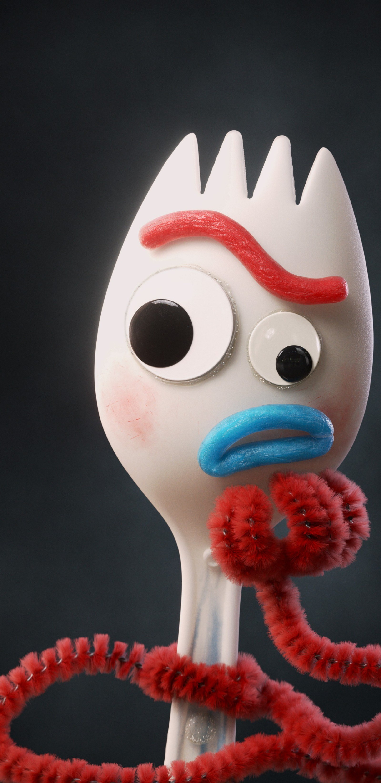 There is a plastic fork with a red and blue handle (boss, disney, forky, four, movie)