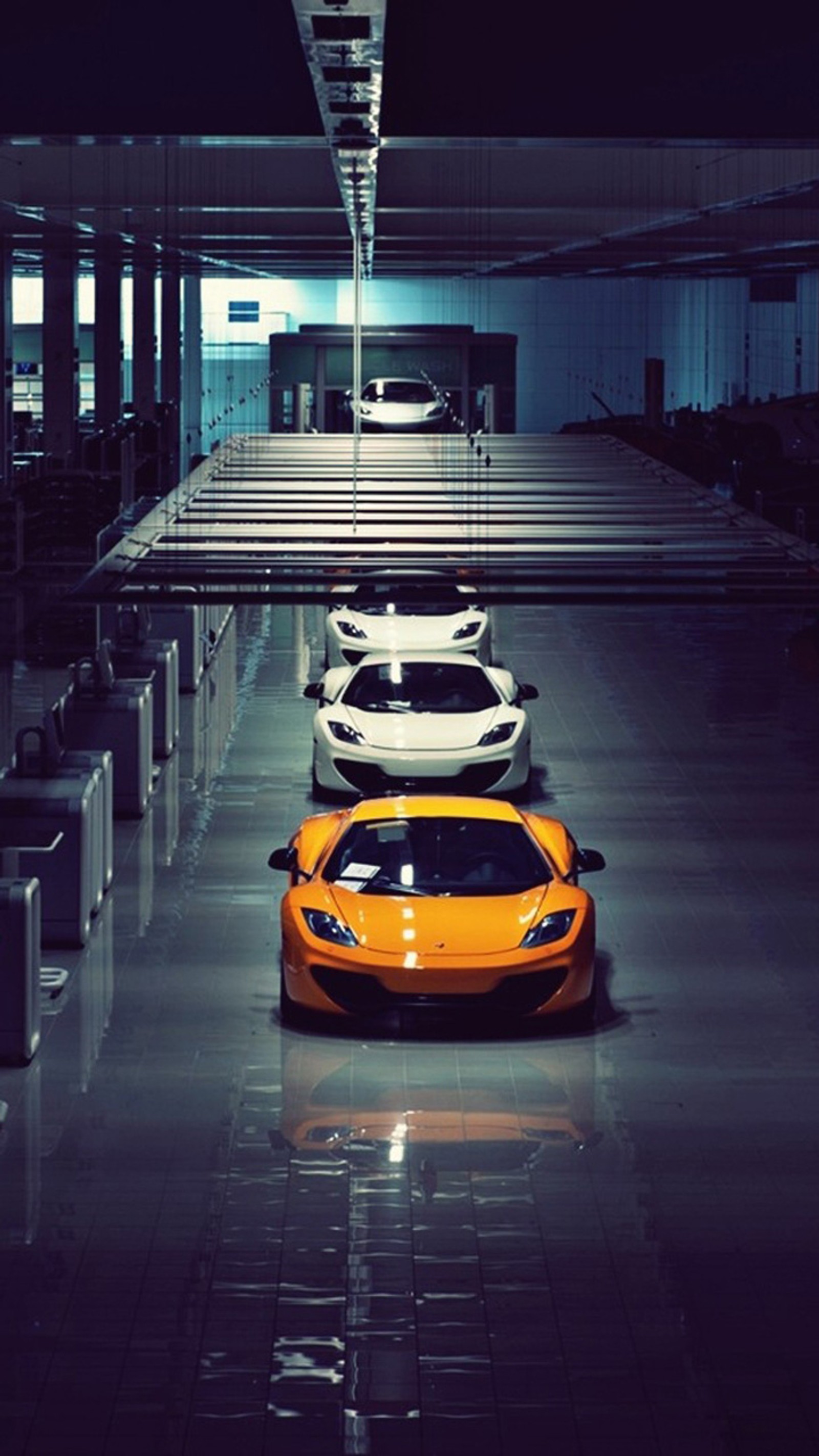 Arafed view of a car garage with a few cars parked in it (auto, cars, lamborghini)