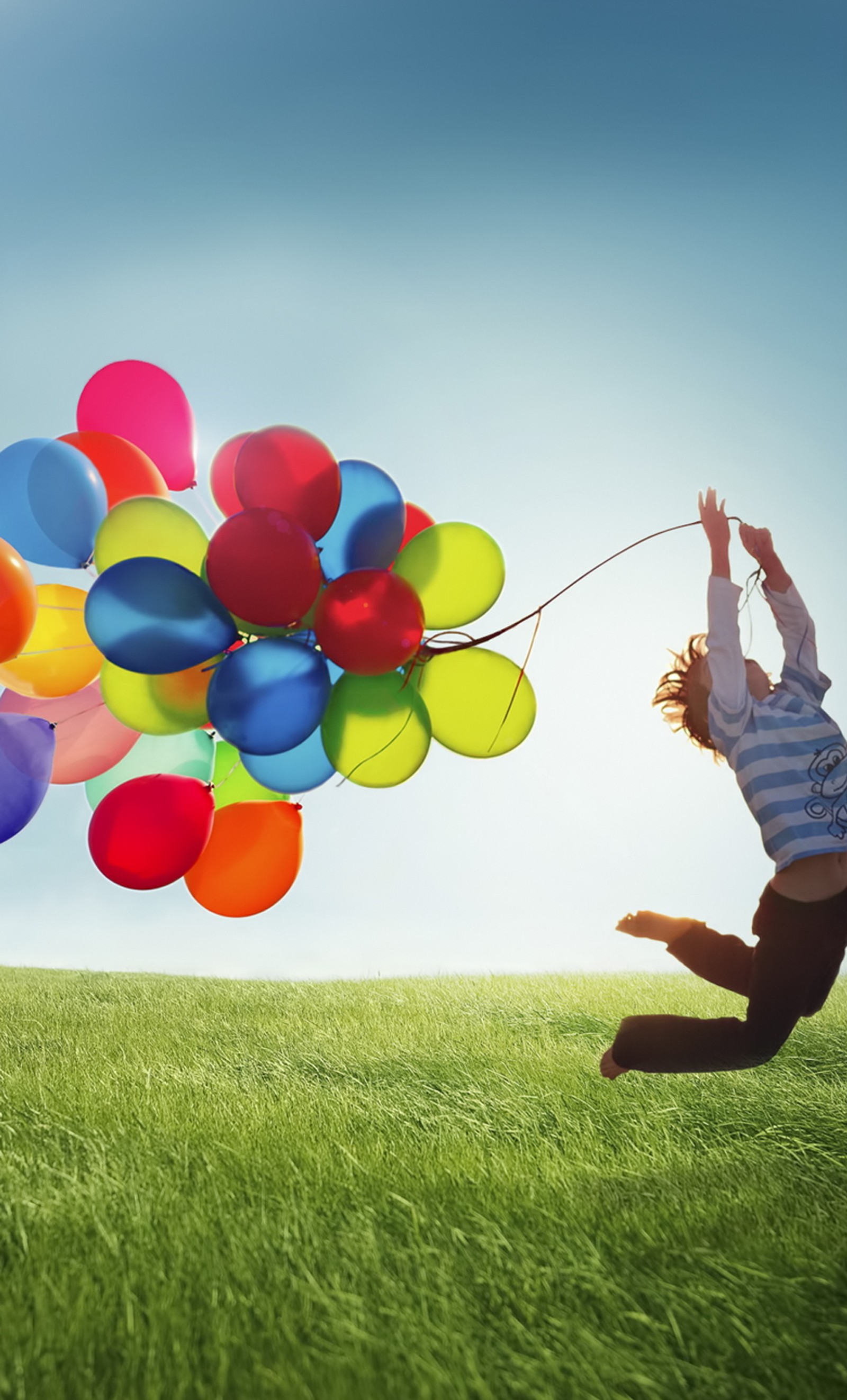 Arafed man jumping in the air with balloons in the air (s4, samsung, siv)