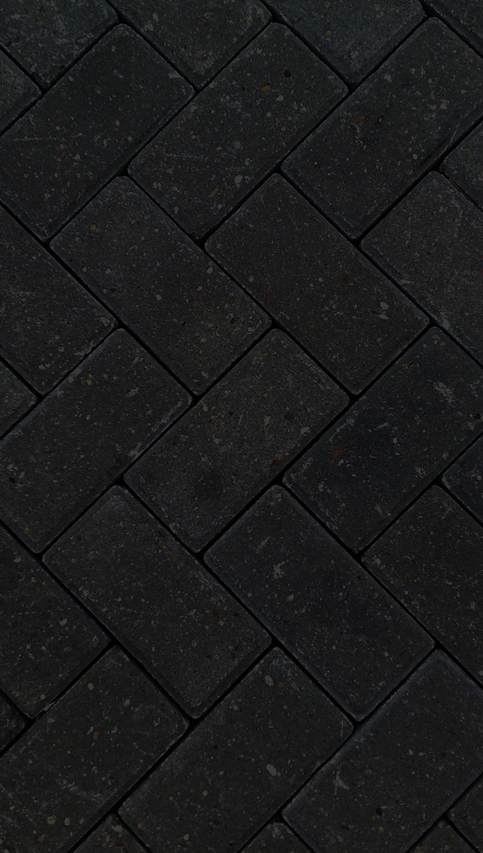 Arafed black brick floor with a white fire hydrant on it (brick, dark)