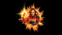 Captain Marvel emerges as a powerful symbol of hope, framed by the Avengers logo and an explosion of energy.