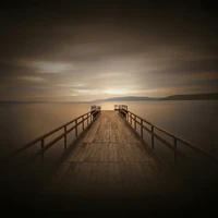 Tranquil Dock at Dusk with Atmospheric Afterglow