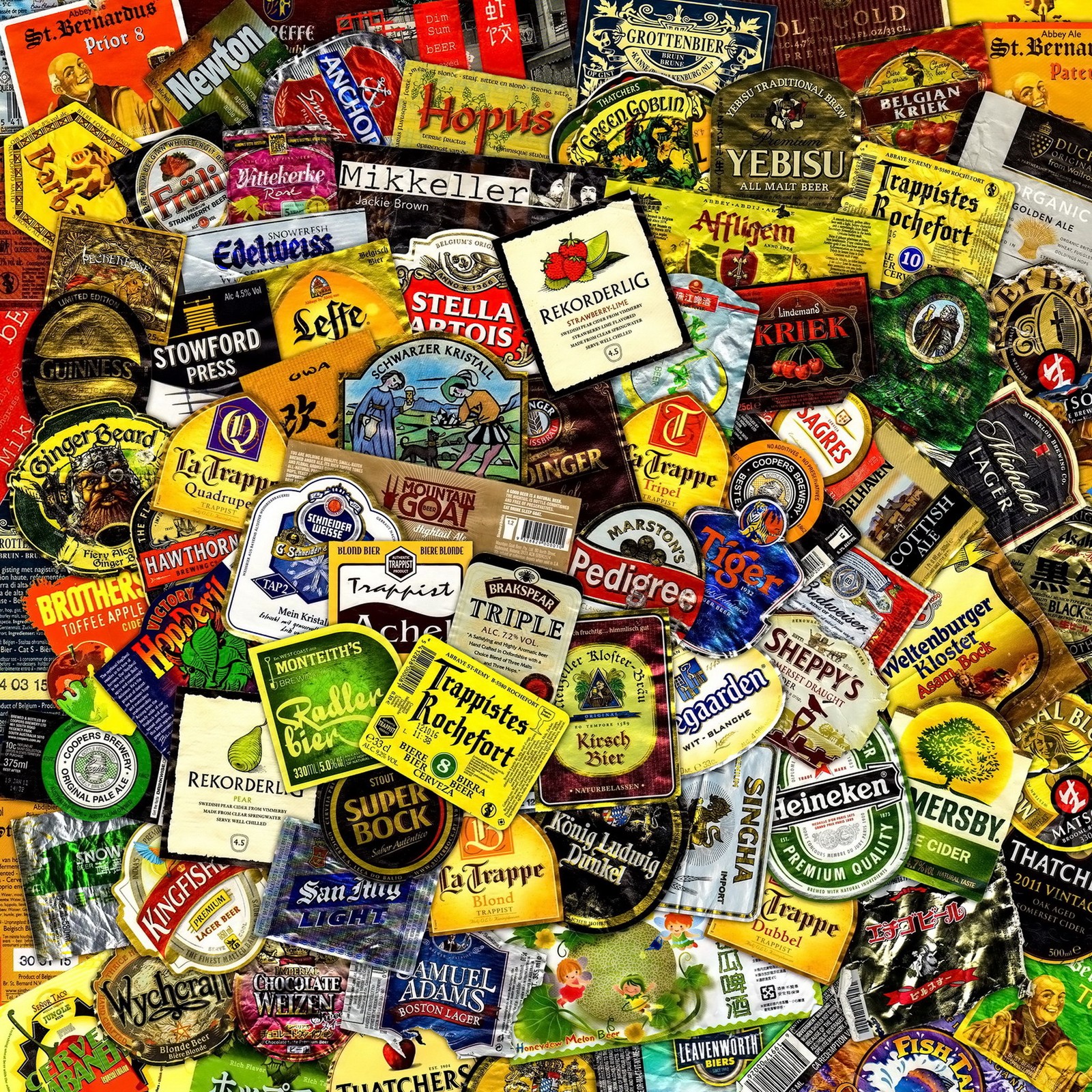 A close up of a pile of different types of beer labels (beer, labels)