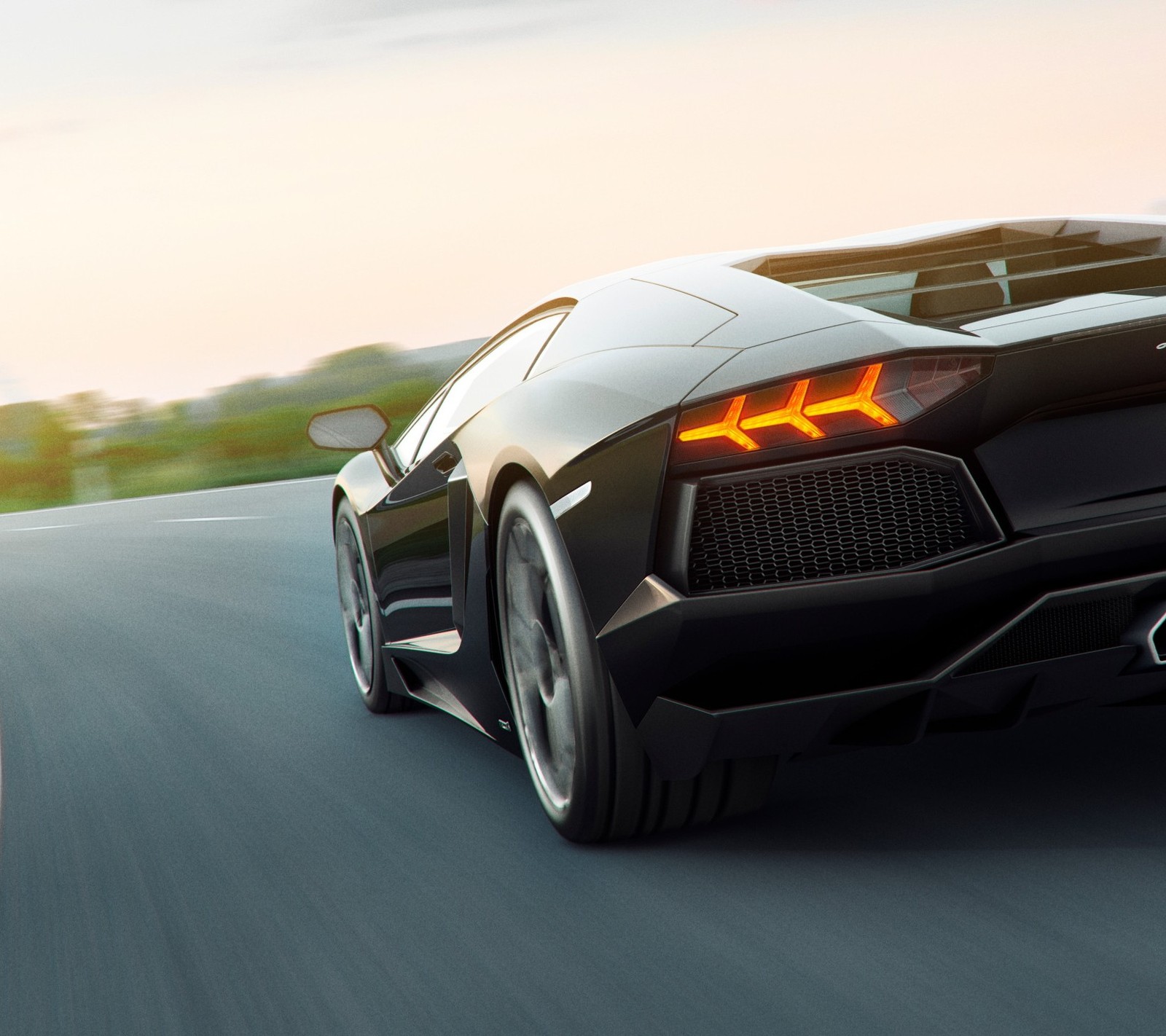 A close up of a black sports car driving on a road (fast, hd, lamborghini)