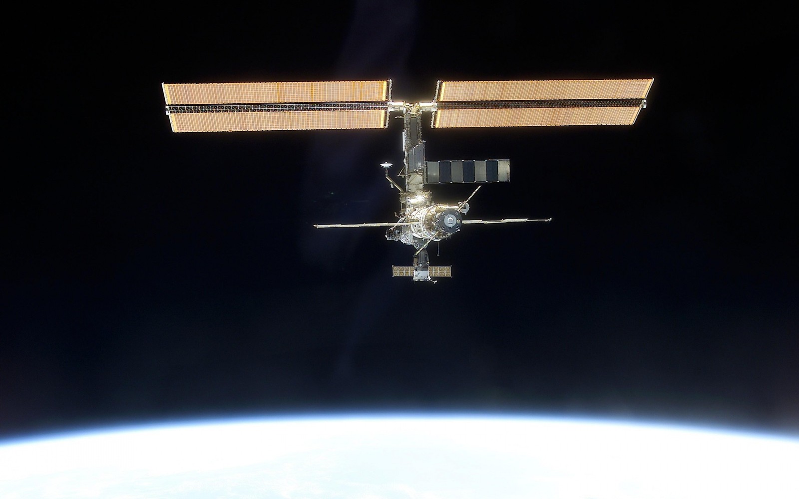 A close up of a space station with a satellite in the background (international space station, satellite, space station, spacecraft, atmosphere of earth)