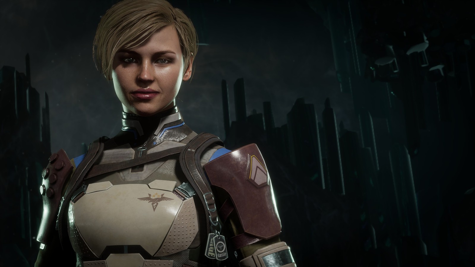 A woman in a futuristic outfit standing in front of a dark background (cassie cage, mortal kombat 11, video game)