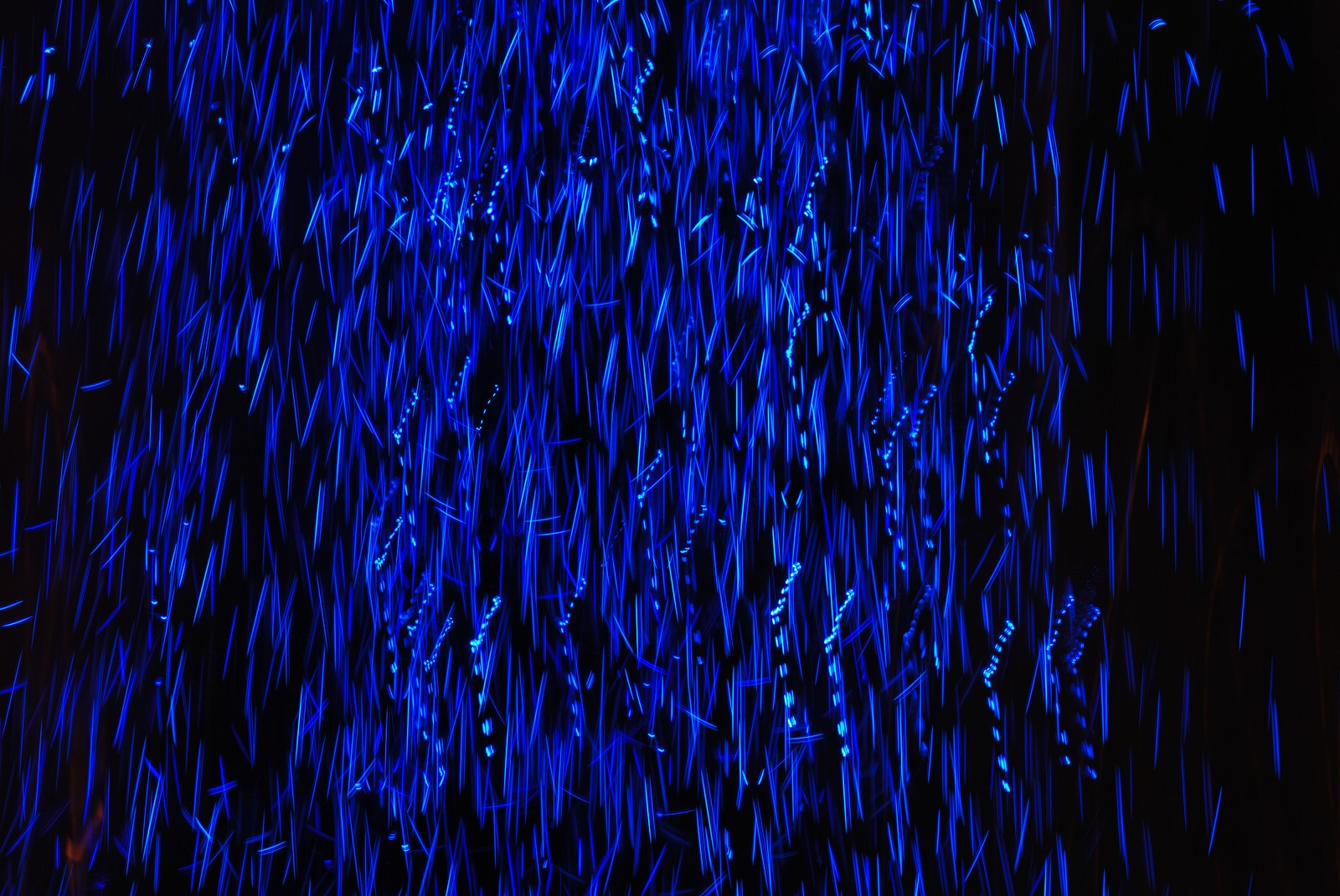 A close up of a blue light in a dark room (darkness, blue, electric blue, cobalt blue, light)