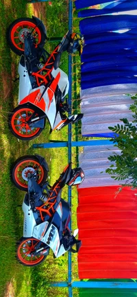 KTM RC Series Motorcycles Against a Colorful Backdrop