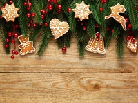 Festive Gingerbread Ornaments Adorned with Evergreen and Red Berries