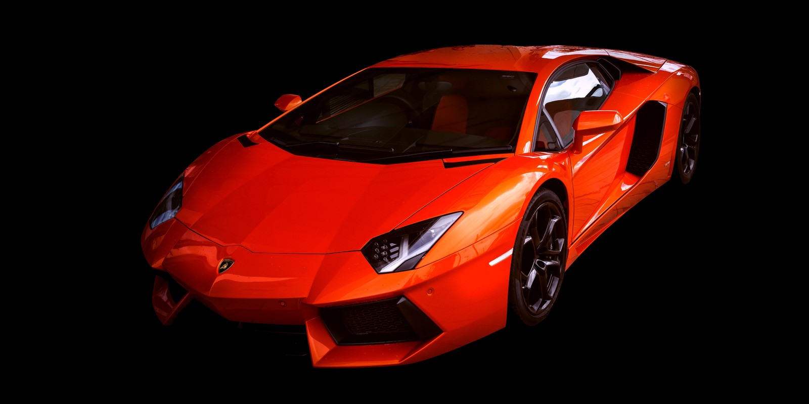 A close up of a red sports car on a black background (lamborghini aventador, black background, red cars, 5k, sports cars)