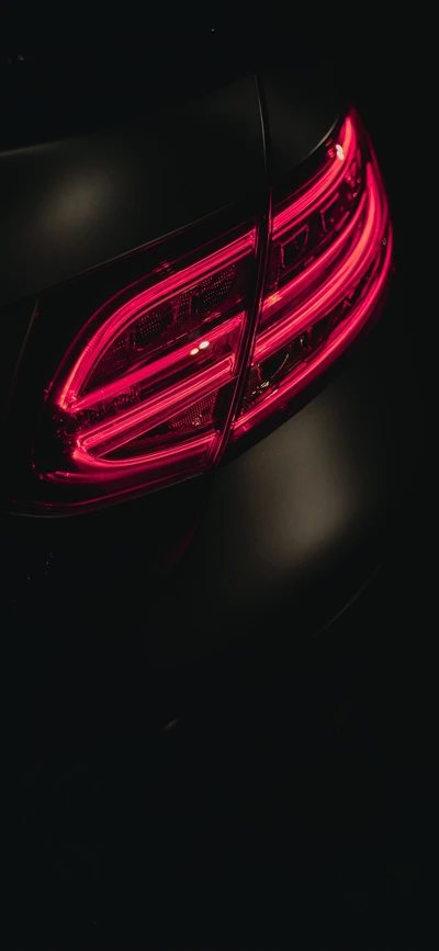 Sleek Sports Car Tail Light Glow in Darkness