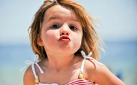 Playful Infant with a Joyful Expression at the Beach