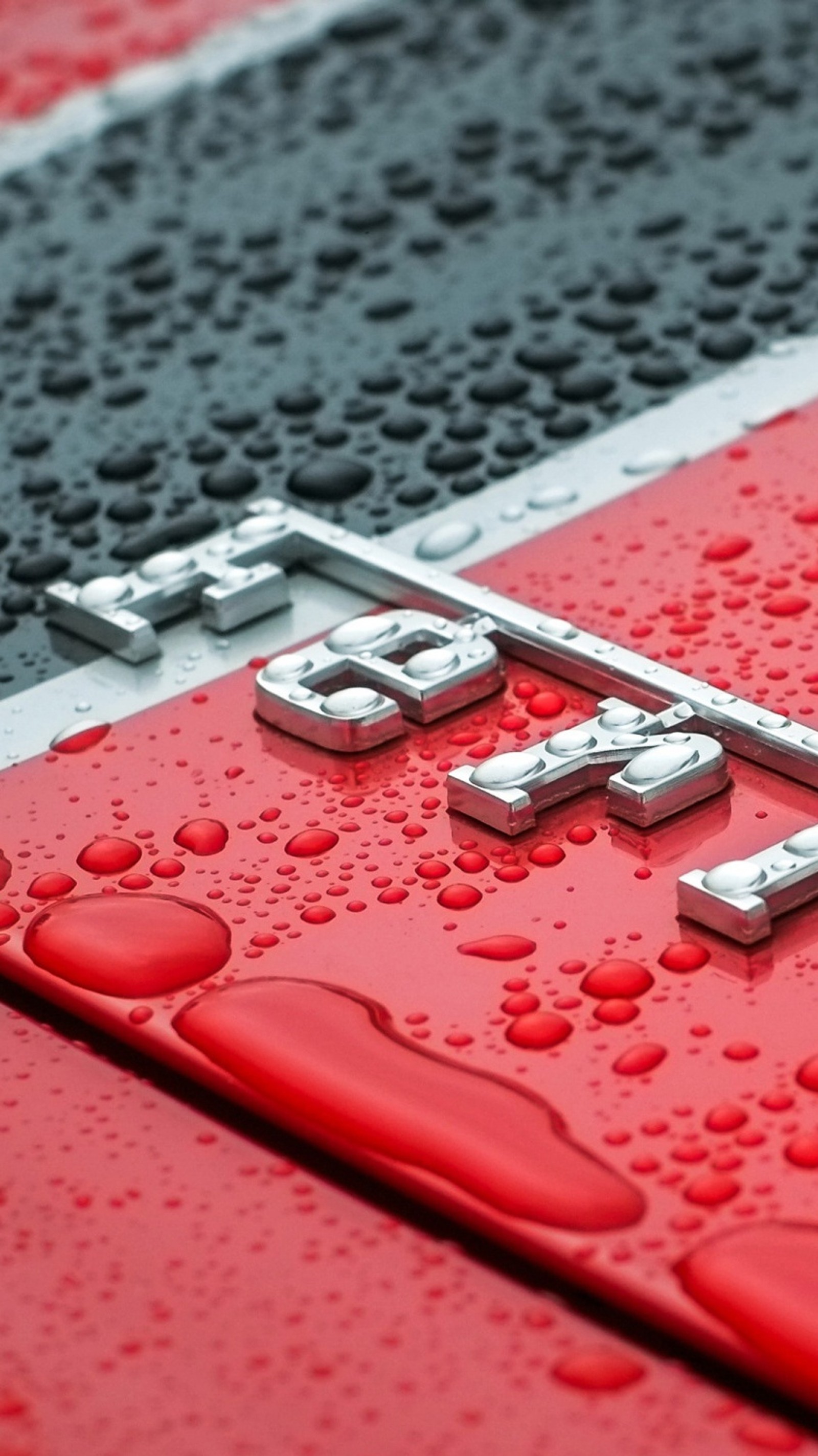 A close up of a red and black car with a red and white stripe (ferari, ferrari)