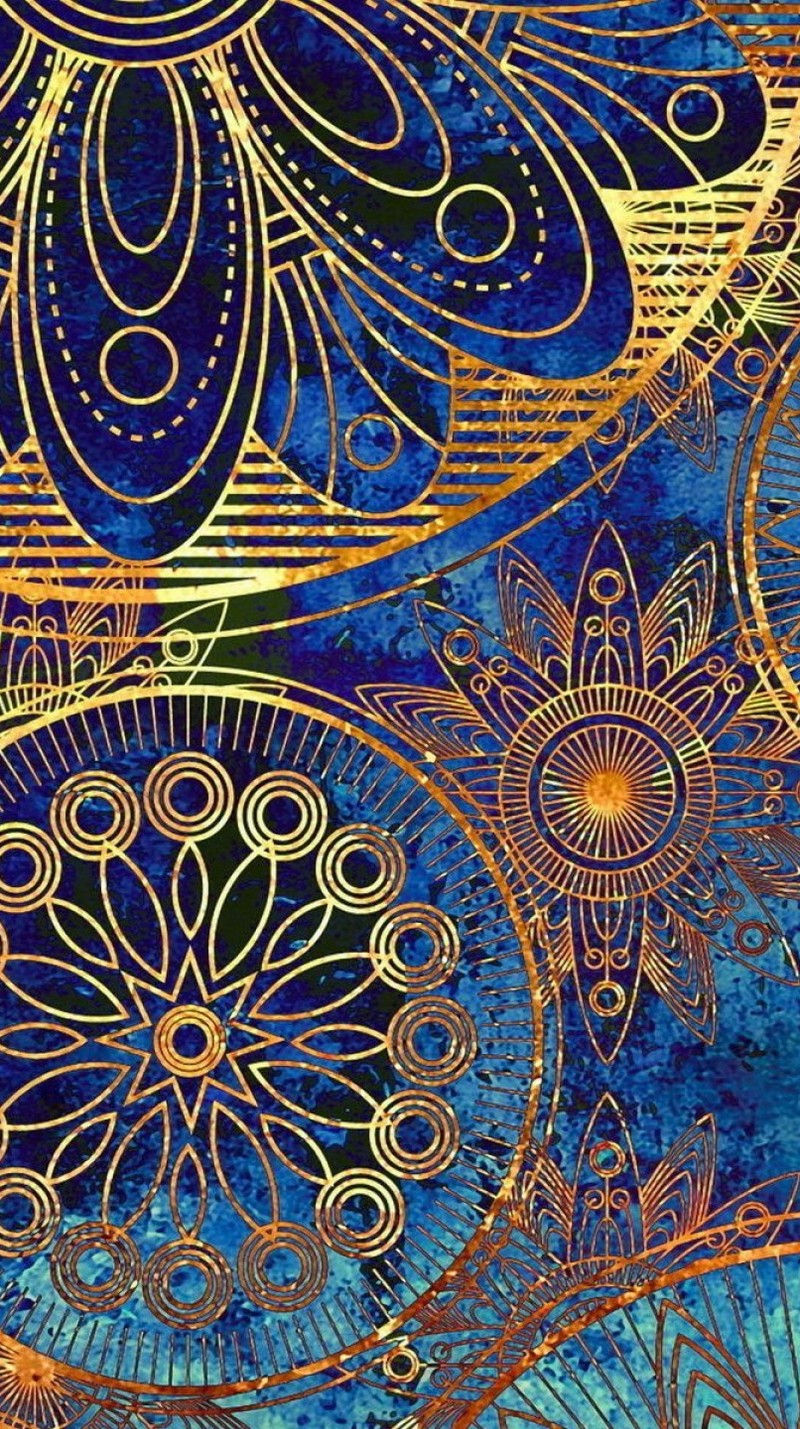 A close up of a blue and gold background with a pattern (abstract, pattern, wine)