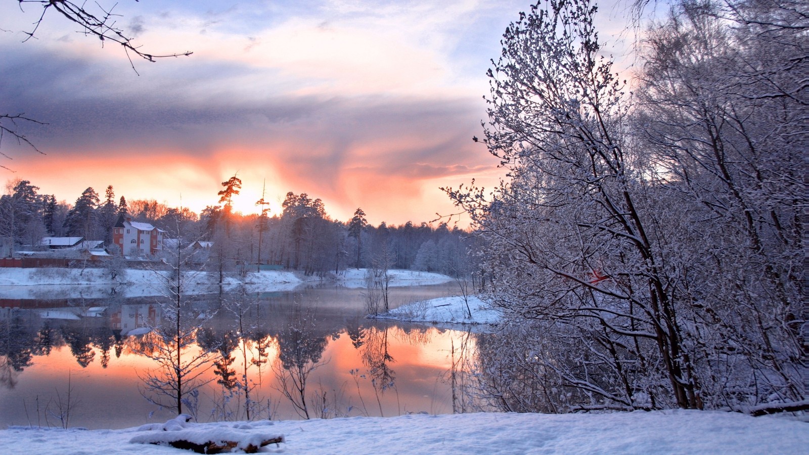 Snowy scene of a lake and a sunset with a few trees (winter, snow, morning, nature, freezing)