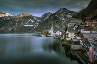 Serene Highland Fjord with Mountain Reflections and Quaint Village