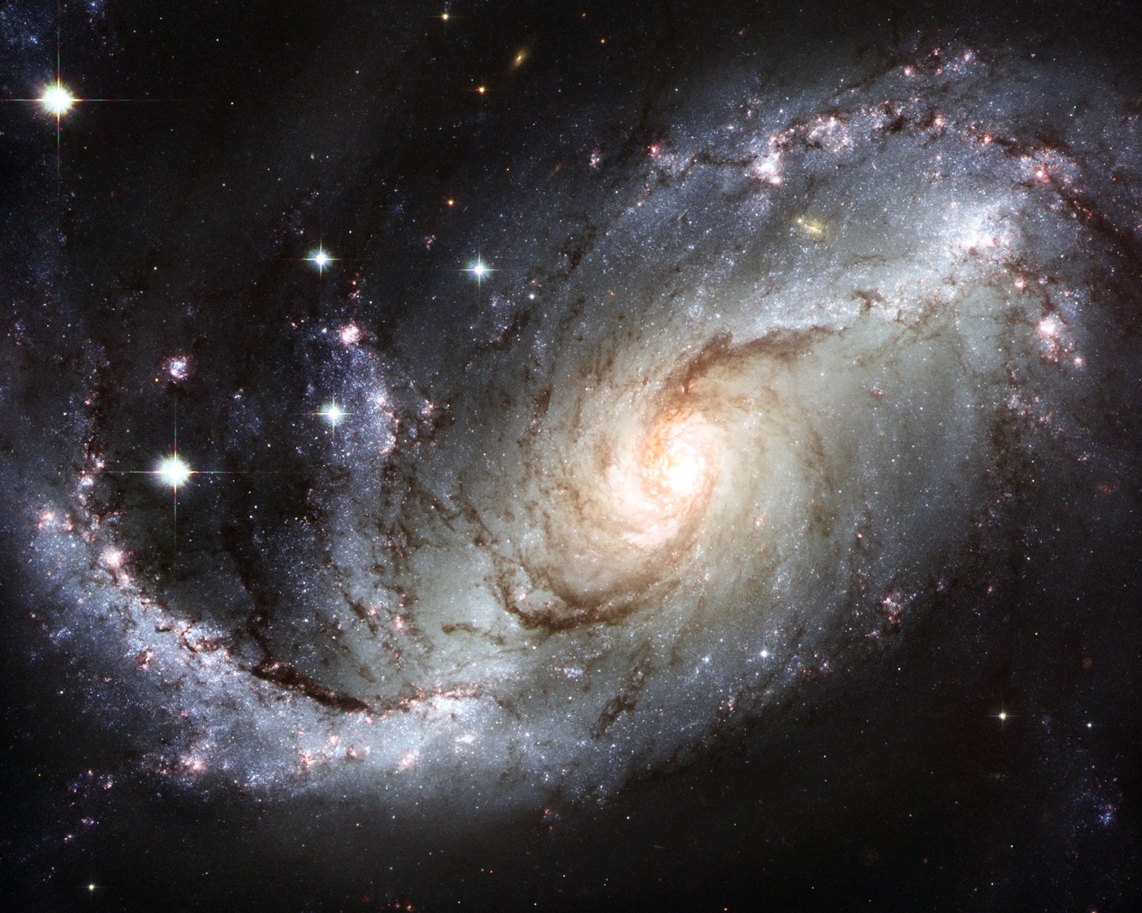 A close up of a spiral galaxy with a star in the background (constelaciones, espacio, space)