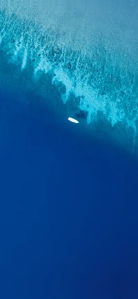 Vibrant Azure Waters with a Sailboat